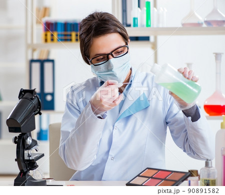 Lab chemist checking beauty and make-up products Lab chemist checking beauty and make-up products 90891582