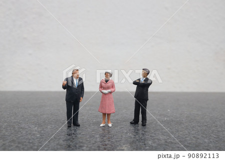a mini of figure Business team discussing a mini of figure Business team discussing 90892113