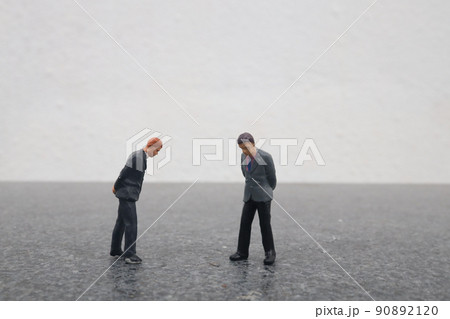 a mini of figure Business team discussing a mini of figure Business team discussing 90892120