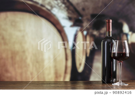 Wine cellar with wine bottle and glasses. Red wine tasting in the wine cellar. Wine cellar with wine bottle and glasses. Red wine tasting in the wine cellar. 90892416