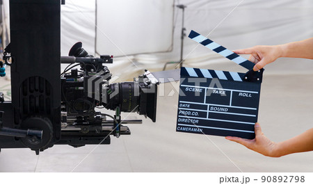 Man hands holding movie clapper. 90892798
