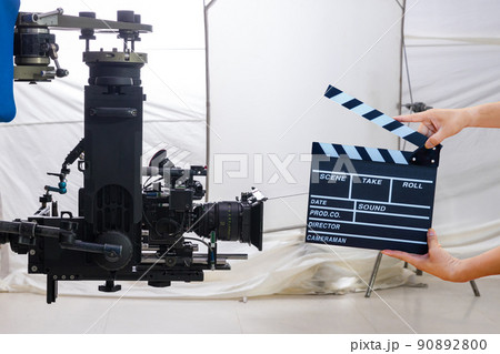 Man hands holding movie clapper. 90892800
