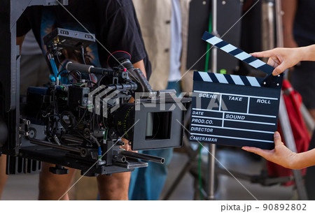 Man hands holding movie clapper. 90892802