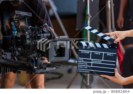 Man hands holding movie clapper. 90892804