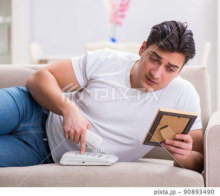 Young man in sad saint valentine concept Young man in sad saint valentine concept 90893490