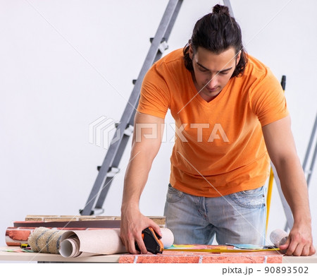 Young man contractor doing renovation at home 90893502