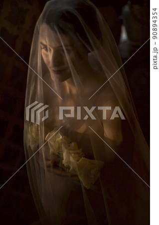 pregnant woman with a veil on her head 90894354