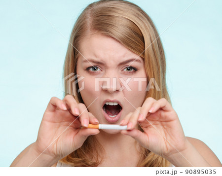 Girl breaking up with cigarette. Girl breaking up with cigarette. 90895035