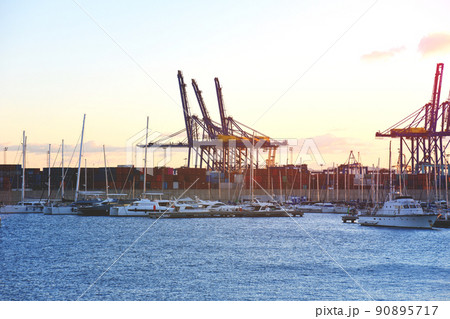 Container crane in seaport on sunset. Container crane in seaport on sunset. 90895717