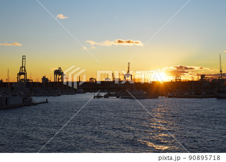 Silhouette of yachts and boats on sunset in the in La Marina de Valencia. Silhouette of yachts and boats on sunset in the in La Marina de Valencia. 90895718