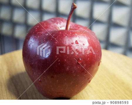 One large red apple. Water droplets on an apple peel. Apple of the Red Chief variety. 90898593