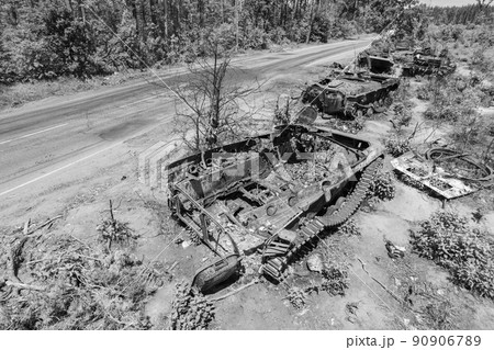 Destroyed military equipment during the war in Ukraine, black and white photo Destroyed military equipment during the war in Ukraine, black and white photo 90906789