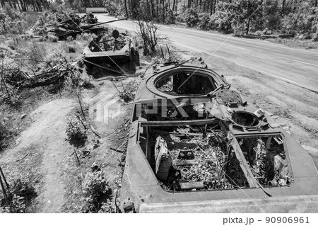 Destroyed military equipment during the war in Ukraine, black and white photo Destroyed military equipment during the war in Ukraine, black and white photo 90906961