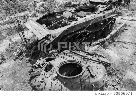Destroyed military equipment during the war in Ukraine, black and white photo 90906971