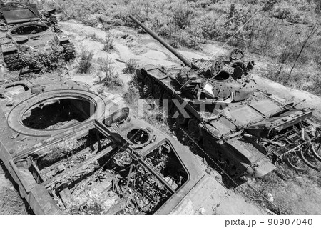 Destroyed military equipment during the war in Ukraine, black and white photo 90907040