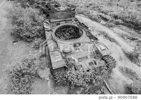 Destroyed military equipment during the war in Ukraine, black and white photo 90907086