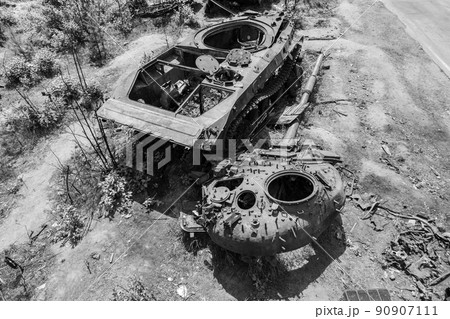 Destroyed military equipment during the war in Ukraine, black and white photo 90907111
