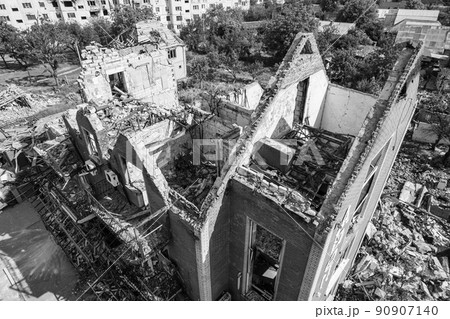 War in Ukraine - destroyed building in Makariv, black and white photo 90907140