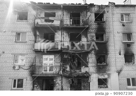War in Ukraine - destroyed building in Makariv, black and white photo 90907230