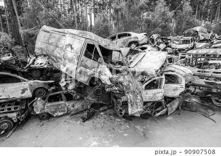 War in Ukraine: a dump of shot and burned cars in Irpin, Bucha district, black and white War in Ukraine: a dump of shot and burned cars in Irpin, Bucha district, black and white 90907508
