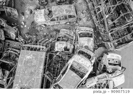 War in Ukraine: a dump of shot and burned cars in Irpin, Bucha district, black and white 90907519