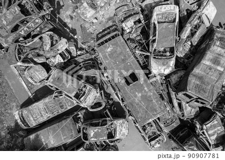 War-destroyed cars in Irpin, Bucha district, Ukraine, black and white 90907781