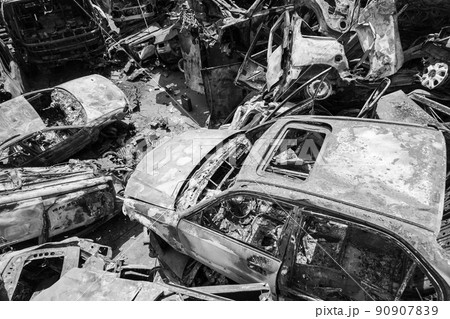 War in Ukraine: a dump of shot and burned cars in Irpin, Bucha district, black and white War in Ukraine: a dump of shot and burned cars in Irpin, Bucha district, black and white 90907839