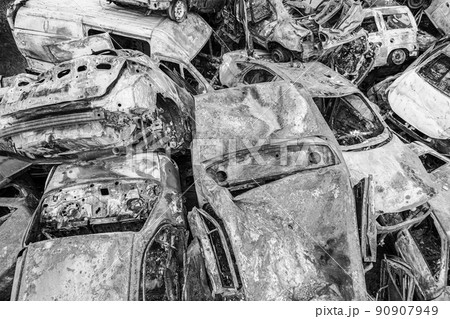 War in Ukraine: a dump of shot and burned cars in Irpin, Bucha district, black and white War in Ukraine: a dump of shot and burned cars in Irpin, Bucha district, black and white 90907949