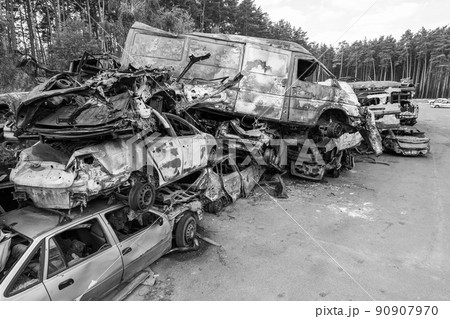 War in Ukraine: a dump of shot and burned cars in Irpin, Bucha district, black and white 90907970