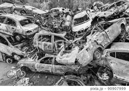 War in Ukraine: a dump of shot and burned cars in Irpin, Bucha district, black and white 90907999