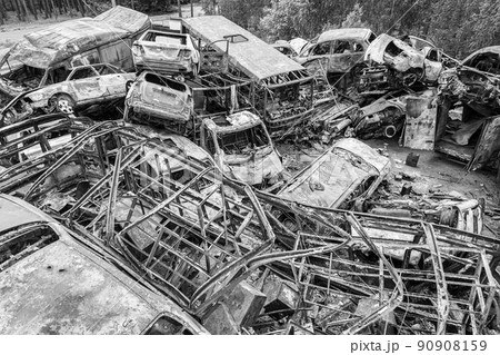 War in Ukraine: a dump of shot and burned cars in Irpin, Bucha district, black and white War in Ukraine: a dump of shot and burned cars in Irpin, Bucha district, black and white 90908159