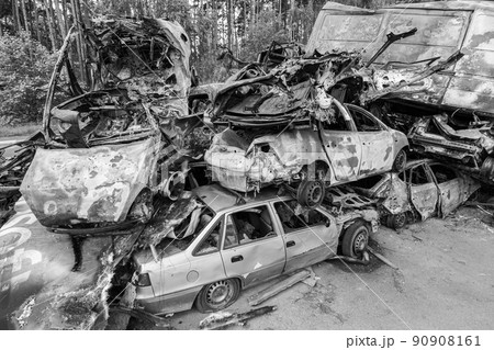 War-destroyed cars in Irpin, Bucha district, Ukraine, black and white War-destroyed cars in Irpin, Bucha district, Ukraine, black and white 90908161