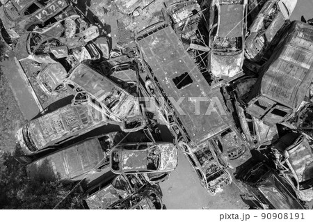 War in Ukraine: a dump of shot and burned cars in Irpin, Bucha district, black and white War in Ukraine: a dump of shot and burned cars in Irpin, Bucha district, black and white 90908191