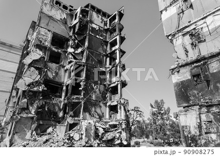 War in Ukraine - destroyed building in Borodyanka, black and white photo War in Ukraine - destroyed building in Borodyanka, black and white photo 90908275