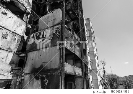 War in Ukraine - destroyed building in Borodyanka, black and white photo War in Ukraine - destroyed building in Borodyanka, black and white photo 90908495