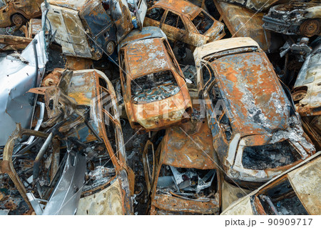 War-destroyed cars in Irpin, Bucha district, Ukraine 90909717