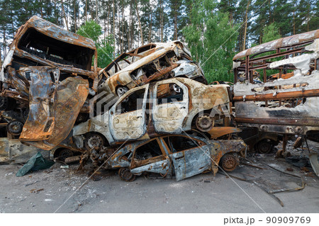 War-destroyed cars in Irpin, Bucha district, Ukraine War-destroyed cars in Irpin, Bucha district, Ukraine 90909769