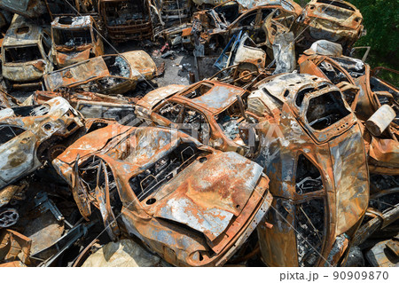 War-destroyed cars in Irpin, Bucha district, Ukraine War-destroyed cars in Irpin, Bucha district, Ukraine 90909870