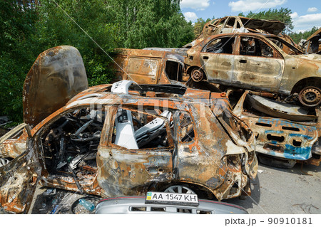 War-destroyed cars in Irpin, Bucha district, Ukraine 90910181