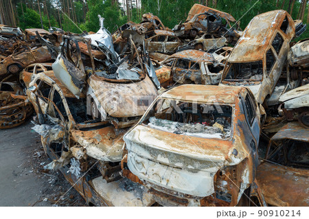 War-destroyed cars in Irpin, Bucha district, Ukraine 90910214