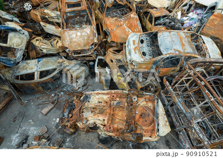 War-destroyed cars in Irpin, Bucha district, Ukraine War-destroyed cars in Irpin, Bucha district, Ukraine 90910521