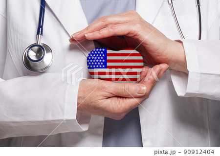 American doctor holding heart 90912404