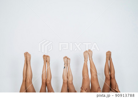 Woman legs pointing up over white background 90913788