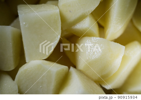 raw potatoes in a casserole on the stove raw potatoes in a casserole on the stove 90915934