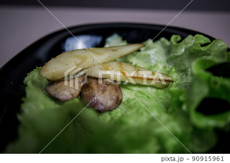 pear with chicken liver in a salad in the kitchen 90915961