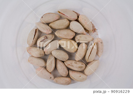 the last closed pistachios in a pack on a white background 90916229