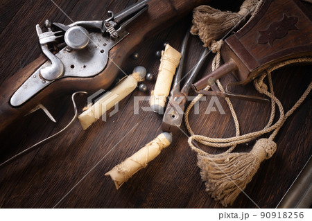17th century ancient flintlock musket with powder flask and led bullets. 17th century ancient flintlock musket with powder flask and led bullets. 90918256