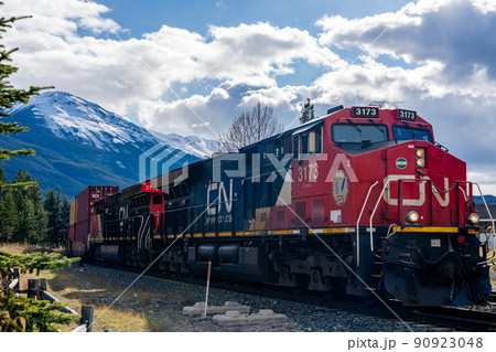 Jasper, Alberta, Canada - May 1 2021 : Canadian National Railway freight train. Canadian Rockies, Jasper National Park. 90923048