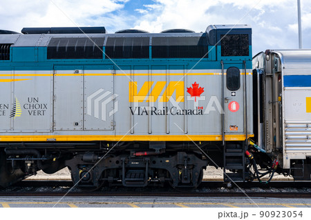 Jasper, Alberta, Canada - May 1 2021 : Via Rail F40PH-2D public passenger train stop at the Jasper station platform. 90923054
