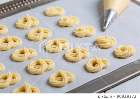 Making danish butter cookies. 90929372